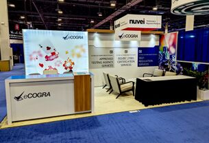 Ecogra Limited completed booth: a graphic back wall with a screen beside a counter and seating area