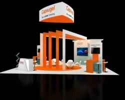 Capsugel booth with tall orange frames, a circular orange floor area and freestanding display screens.