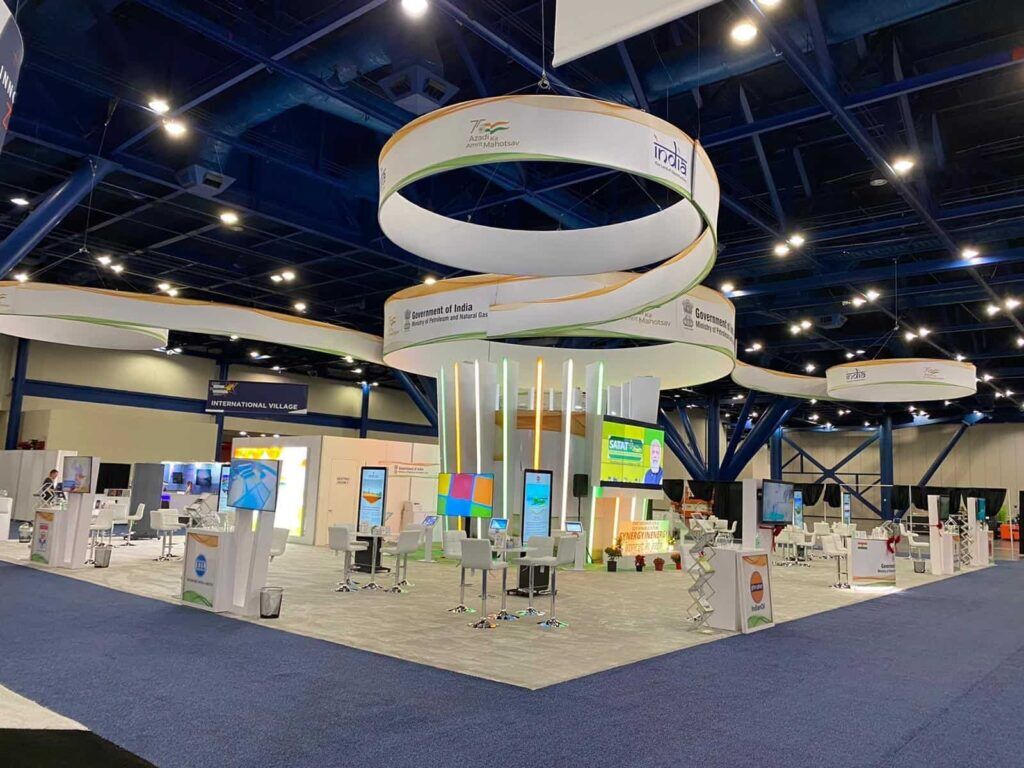 IOCL completed booth: large circular hanging structures above an energy-map graphic and display counters
