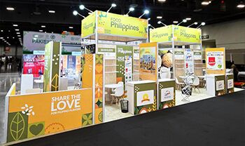Philippines Pavilion (CITEM) completed booth: a pavilion canopy above multiple display kiosks and reception counters