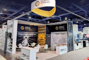 World Gasket Ellegi completed booth: a circular hanging sign above product shelving and display counters