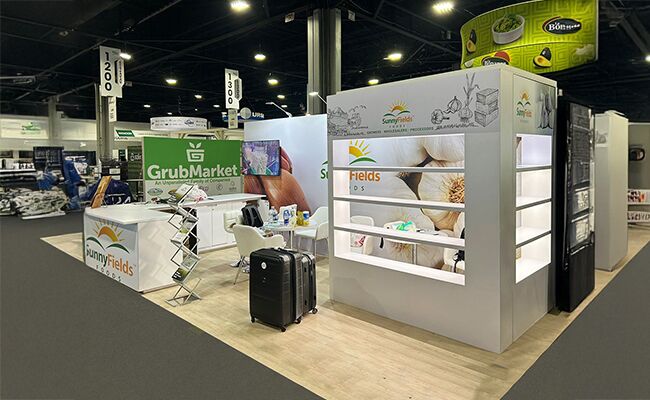 Nehal Naturals completed booth: tiered product shelves around a central reception counter and seating