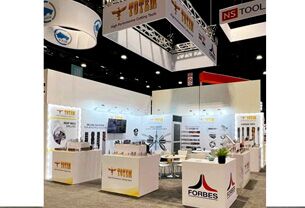 Forbes & Company Limited completed booth: a rectangular hanging sign above product panels and reception counters
