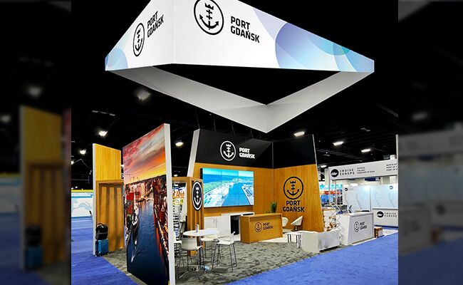 Port Gdansk completed booth: a large rectangular hanging sign above graphic panels and display counters