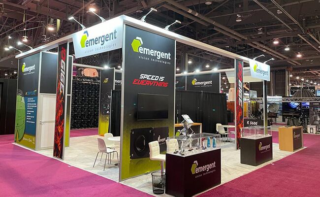 Emergent Vision Technologies completed booth: display panels and screens beneath an open overhead frame