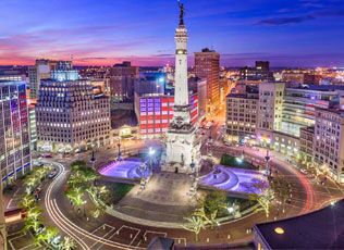Indianapolis Monument Circle illuminated at dusk