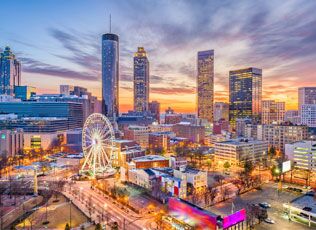 Atlanta skyline illuminated at dusk