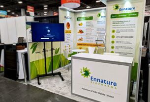 Ennature Biopharma completed booth: a corner display with botanical graphics, product shelves and a counter